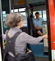 Commuter Boarding a Bus with BackTpack