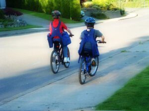 Children cycling with BackTpack