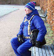 Man in Denmark resting comfortably on a bench wearing his BackTpack