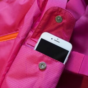BackTpack 3.1 magenta cellphone pocket with cellphone, detail photo