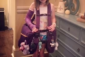 Little girl with scoliosis brace and her purple BackTpack for school