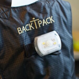 BackTpack bikelight attachment on back panel of black BackTpack 3.1
